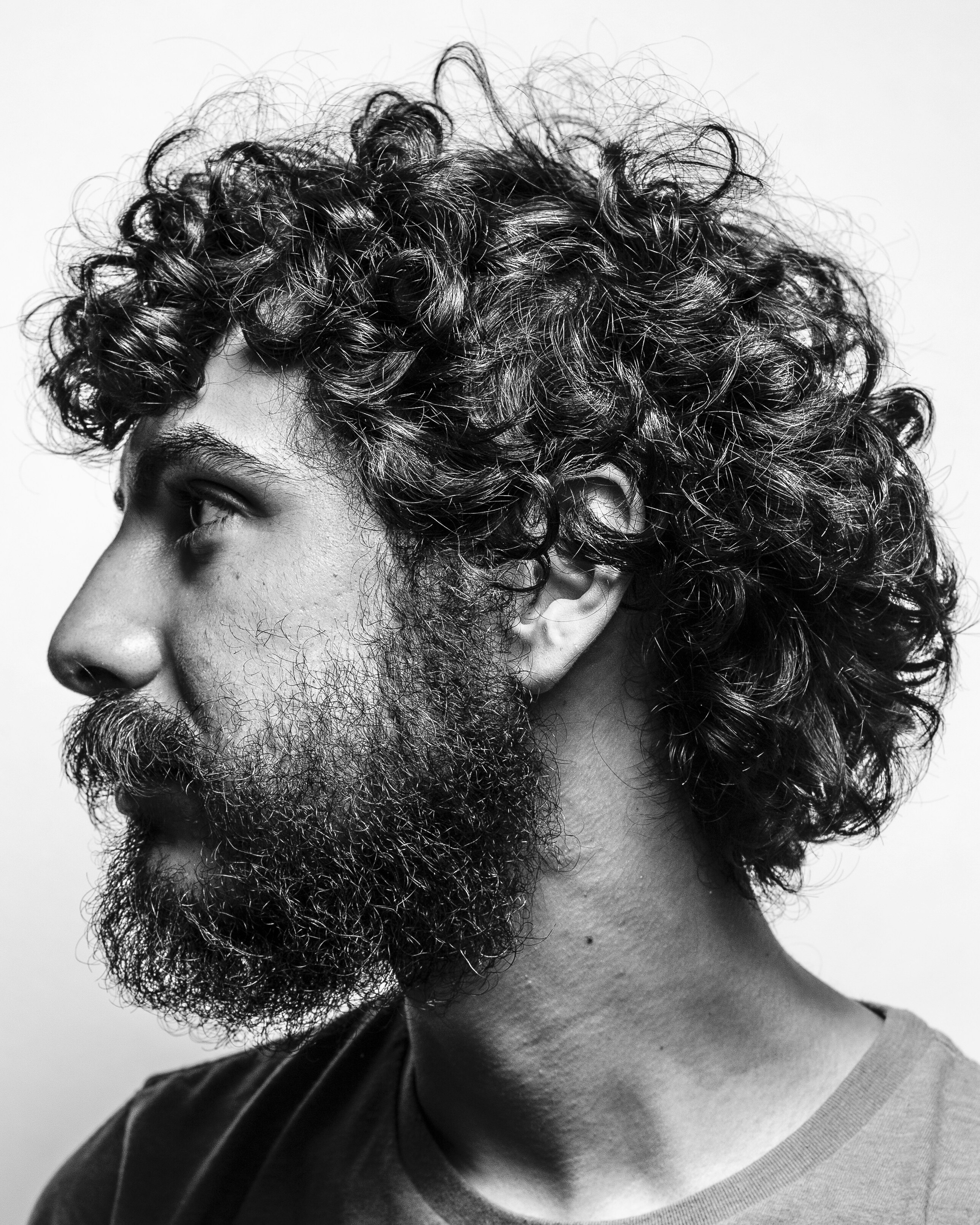 A thoughtful person in an introspective editorial portrait